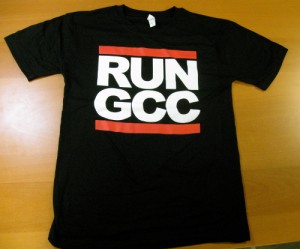 'It's Tricky, to compile software that's right on time . . . ' The 'Run GCC' shirt and stickers from the Free Software Foundation were a hit at LinuxFest Northwest (Free Software Foundation)
