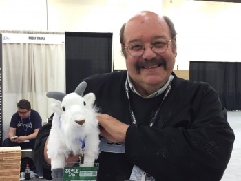 Taking a minute from talking with Dru Lavigne and Deb Goodkin at the FreeBSD booth to pose with a booth denizen, the BSD goat. (Photo by Deb Goodkin)