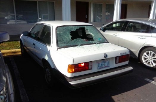 Vandalized auto Econo Lodge parking lot.