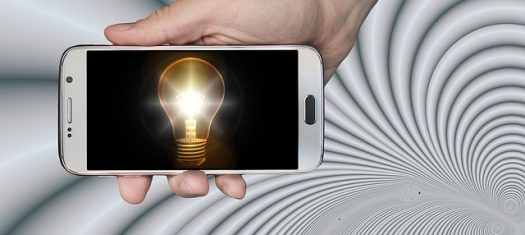 Mobile phone displaying image of a light bulb