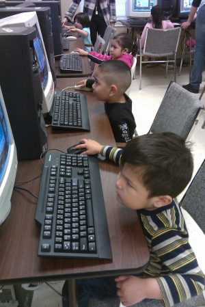 Boys learning computers