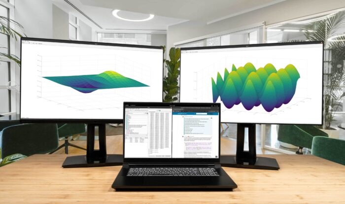 System76's Serval WS laptop connected to two external monitors.