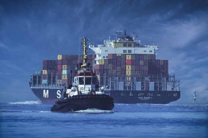 Container ship and tug