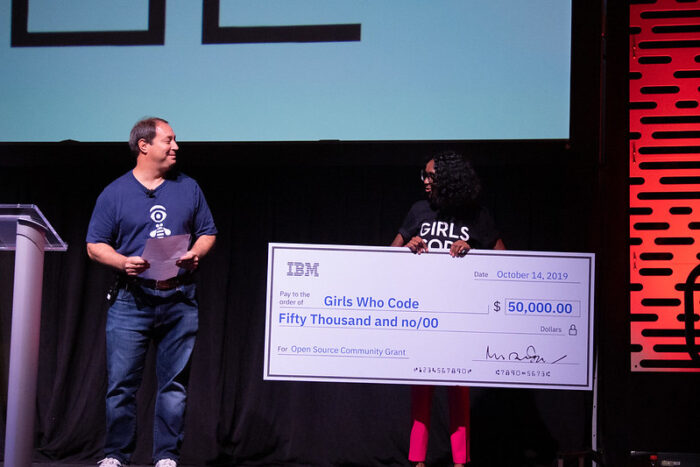 Giant $50,000 being presented onstage to Girls Who Code from IBM.