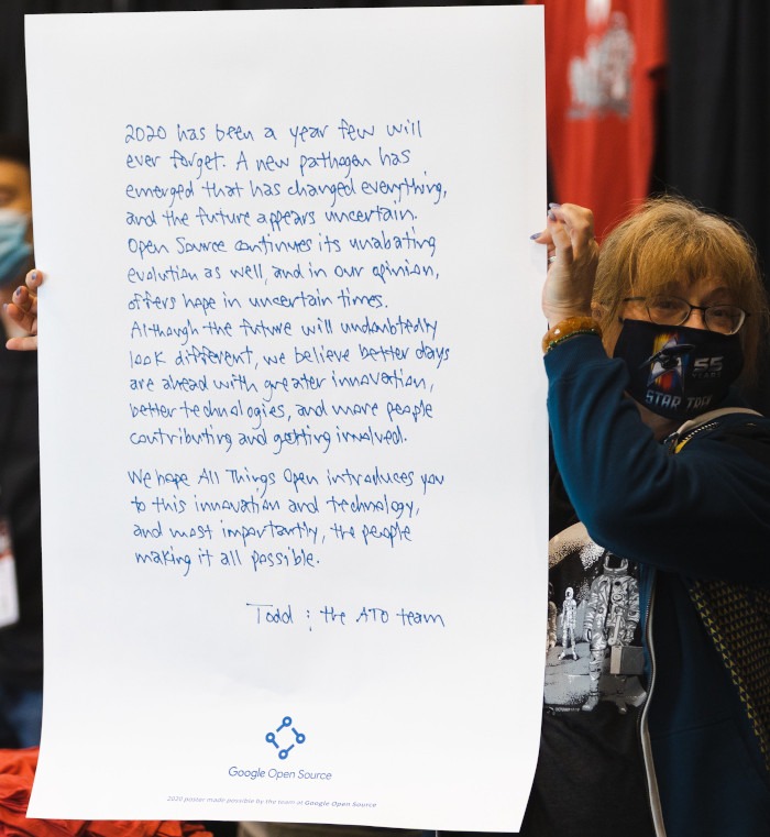 A poster-sized letter from All Things Open's chairperson, Todd Lewis, offering hope for the future as the pandemic slowly moves to the past.