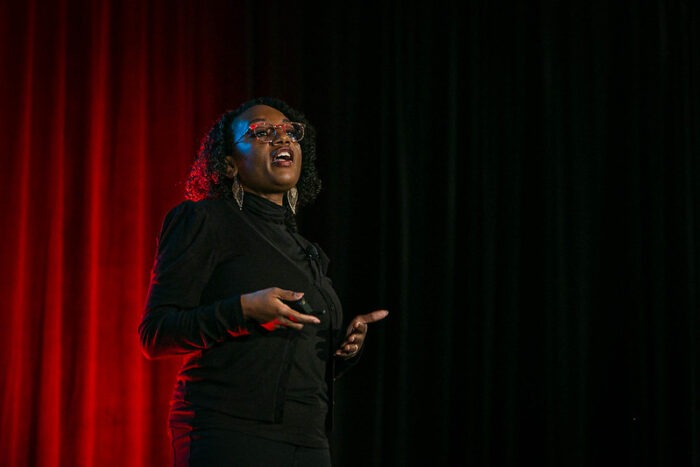 Angie Jones, Global VP of Developer Relations at TBD @ Block, giving a keynote address at All Things Open 2022.