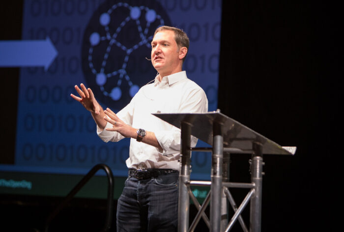 Jim Whitehurst giving a keynote speech at All Things Open 2015.