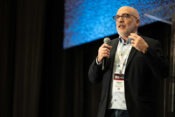 Stefano Maffulli unveiling the Open Source AI Definition at All Things Open 2024.
