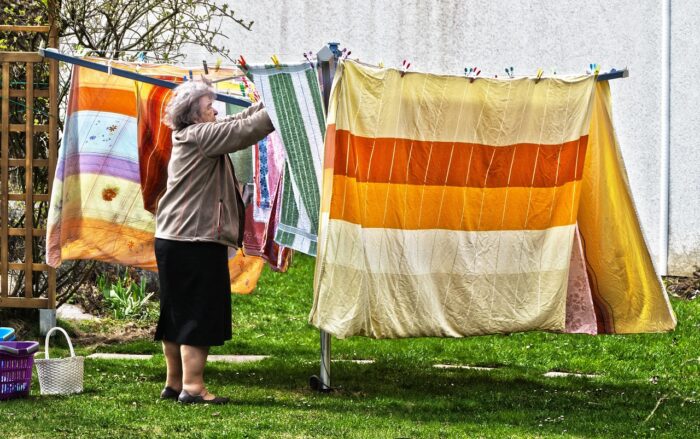 Woman hanging clothes to dry.