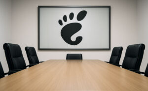 Empty boardroom table with Gnome logo on the wall.