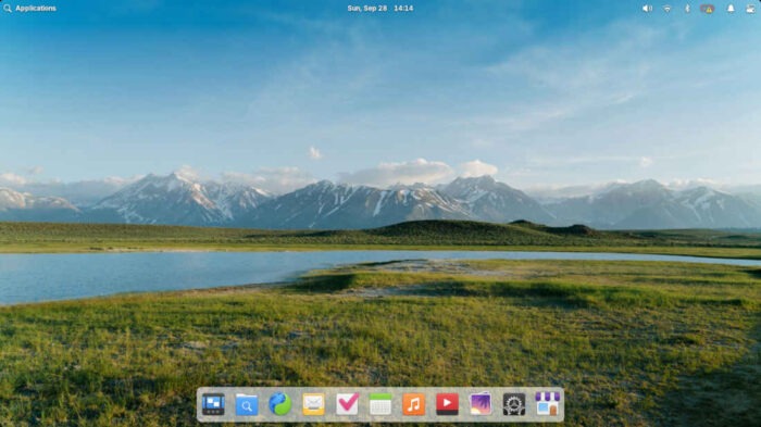 The default desktop in elementaryOS 8.0.2 features a dock at the bottom with a row of relevant icons in the top panel.