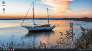 Budgie's default wallpaper shows a boat at anchor with a cityscape in the background.
